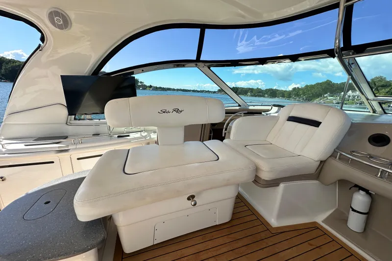 Slide: The Image of Luxurious interior of 2006 Sea Ray 52 Sundancer yacht with plush seating and scenic view. - 8