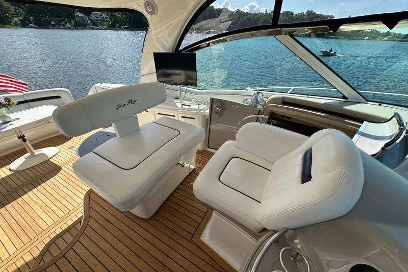 Slide: The Image of Luxurious 2006 Sea Ray 52 Sundancer yacht interior with plush seating and scenic water view. - 9