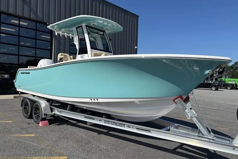 Slide: The Image of 2026 Sportsman Heritage 231 boat on trailer, displayed outdoors. - 10