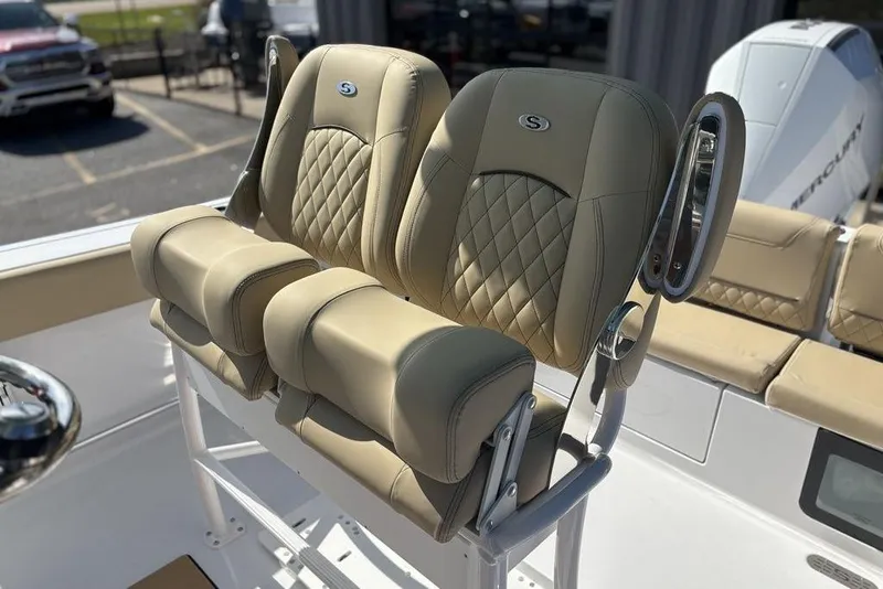 Slide: The Image of 2026 Sportsman Heritage 231 boat seats with diamond stitching and armrests. - 12