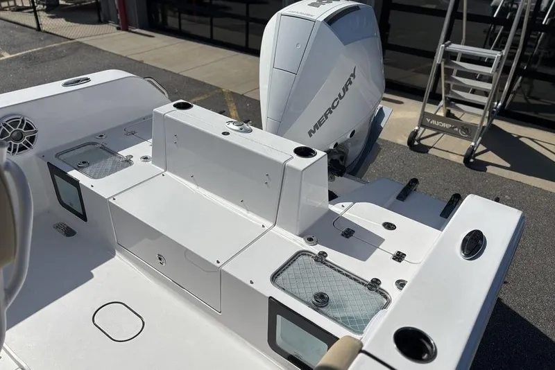 Slide: The Image of 2026 Sportsman Heritage 231 boat with Mercury engine, featuring a sleek deck design. - 17