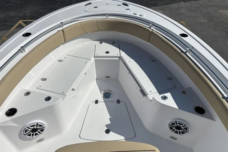 Slide: The Image of 2026 Sportsman Heritage 231 boat interior with seating and storage compartments. - 22
