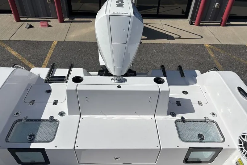 Slide: The Image of 2026 Sportsman Heritage 231 boat with Mercury engine, viewed from above, showcasing deck layout. - 25