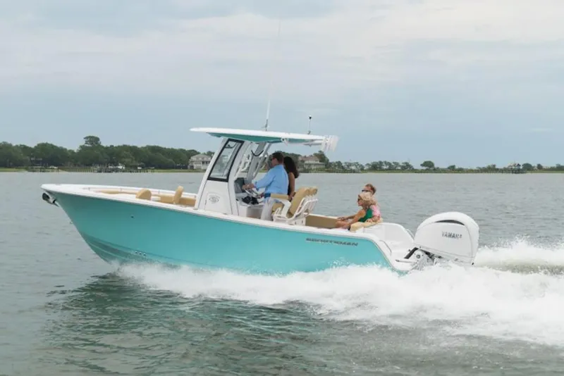 Slide: The Image of 2026 Sportsman Heritage 231 boat cruising on water with passengers enjoying the ride. - 33