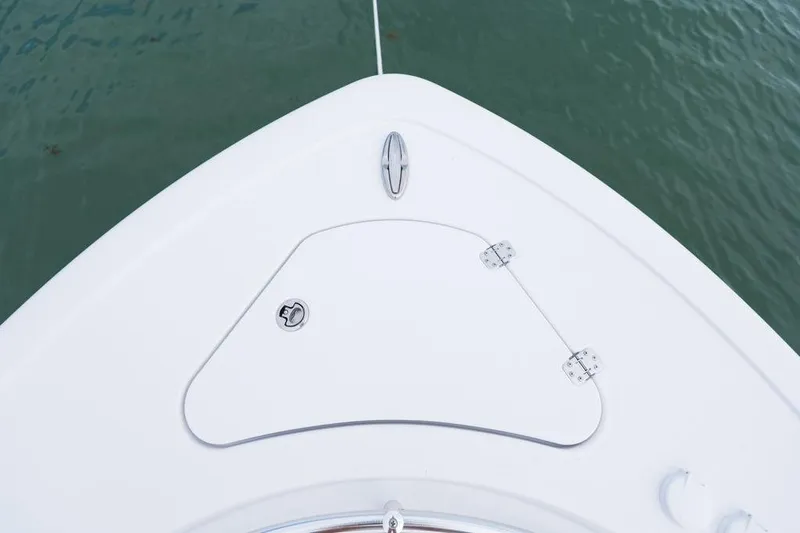 Slide: The Image of Bow of 2026 Sportsman Heritage 231 boat on water, featuring storage hatch. - 35