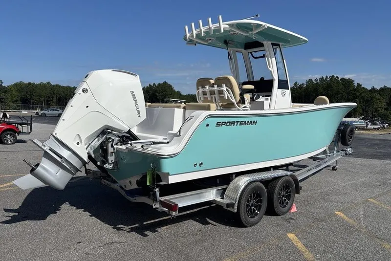 Slide: The Image of 2026 Sportsman Heritage 231 boat on trailer, featuring a Mercury outboard motor. - 4