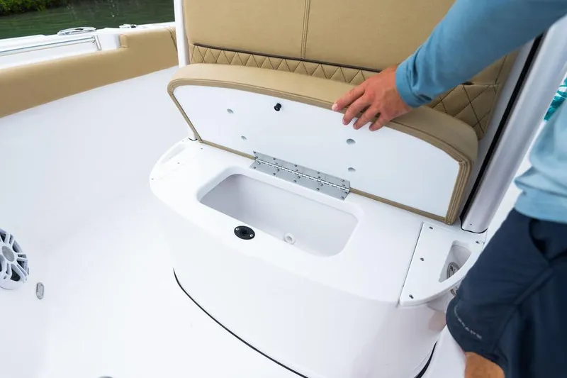 Slide: The Image of 2026 Sportsman Heritage 231 boat seat storage compartment being opened. - 41