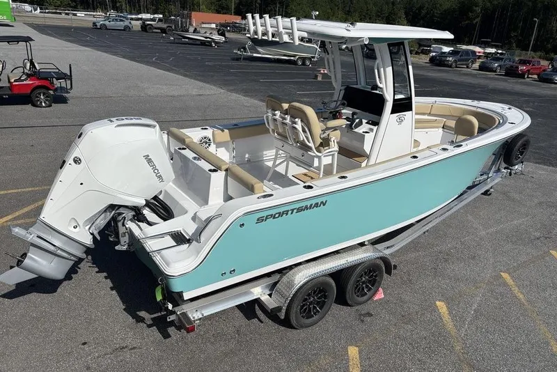 Slide: The Image of 2026 Sportsman Heritage 231 boat on trailer, featuring a Mercury outboard engine. - 5