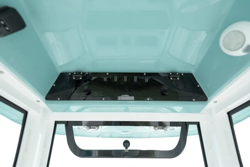 Slide: The Image of 2026 Sportsman Heritage 231 boat interior ceiling view with storage compartment. - 52