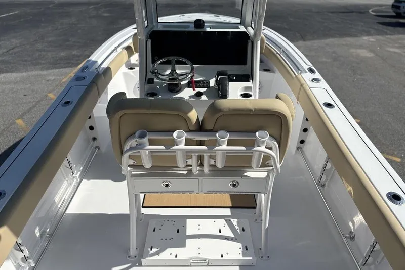Slide: The Image of 2026 Sportsman Heritage 231 boat interior with steering console and seating. - 6