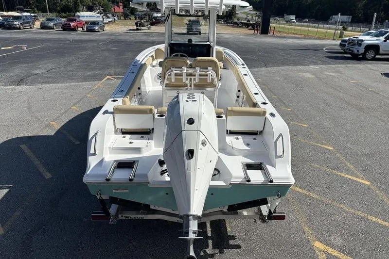 Slide: The Image of 2026 Sportsman Heritage 231 boat on trailer in parking lot. - 9