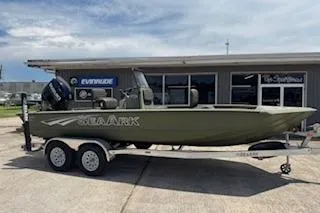 The Image of 2023 SeaArk 2072 VFX Elite CC boat on trailer, parked outside dealership. - 1