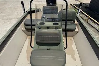 Slide: The Image of 2023 SeaArk 2072 VFX Elite CC boat interior with seating and console. - 5