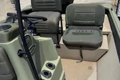 Slide: The Image of 2023 SeaArk 2072 VFX Elite CC boat interior with seating and console. - 6