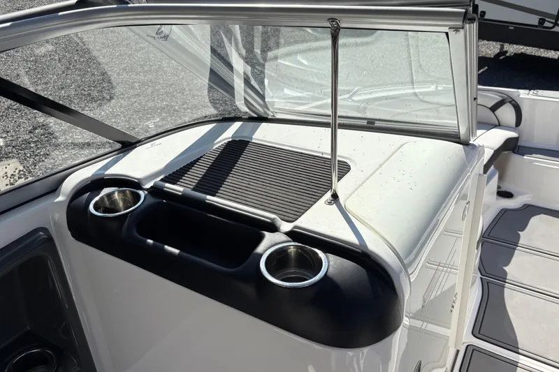 Slide: The Image of 2013 Yamaha Boats AR240 HO interior with cup holders and windshield. - 16