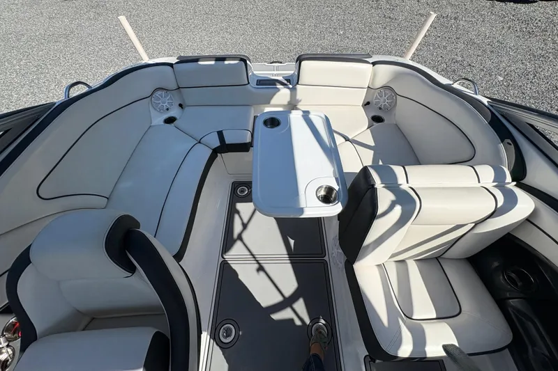 Slide: The Image of 2013 Yamaha Boats AR240 HO interior with white seating and table setup. - 18