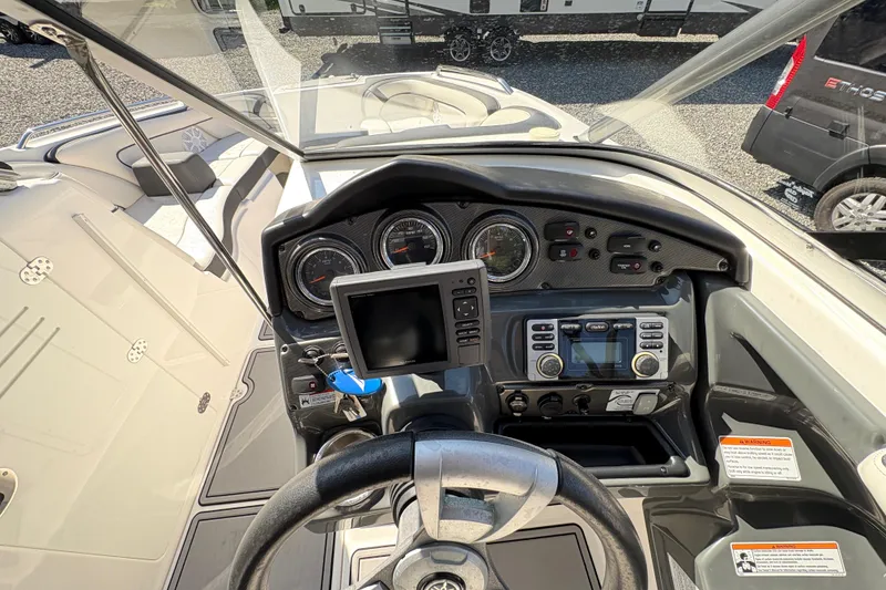 Slide: The Image of 2013 Yamaha Boats AR240 HO dashboard with steering wheel and control panel. - 20