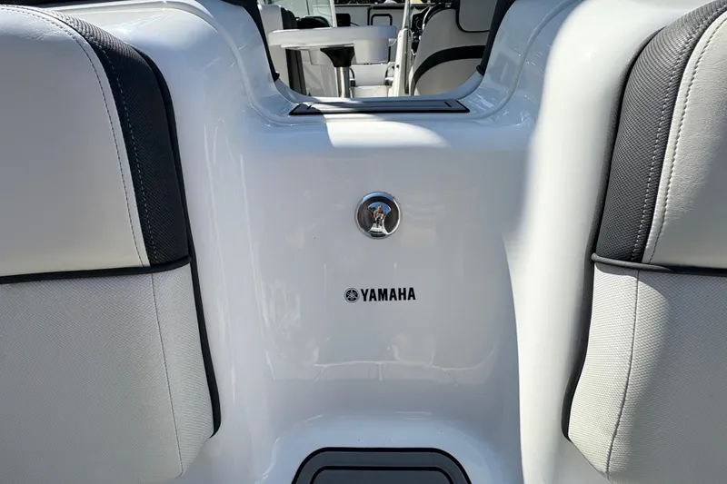 Slide: The Image of 2013 Yamaha Boats AR240 HO interior with white seating and logo detail. - 24