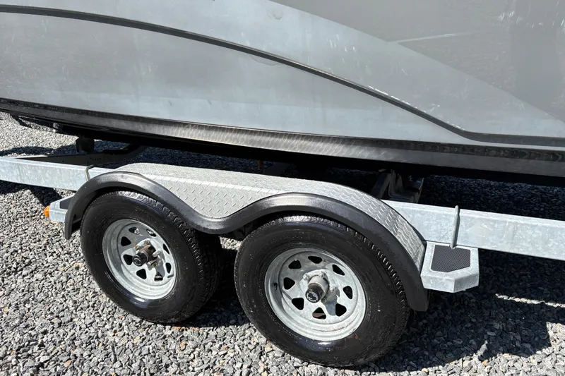 Slide: The Image of Trailer for 2013 Yamaha Boats AR240 HO on gravel surface. - 8