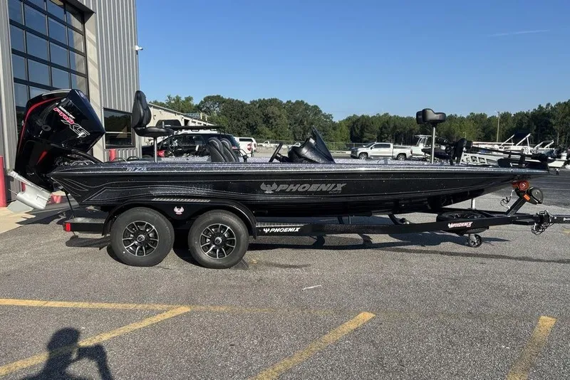 The Image of 2026 Phoenix 721 ZXL boat on trailer, parked outdoors near a building. - 0
