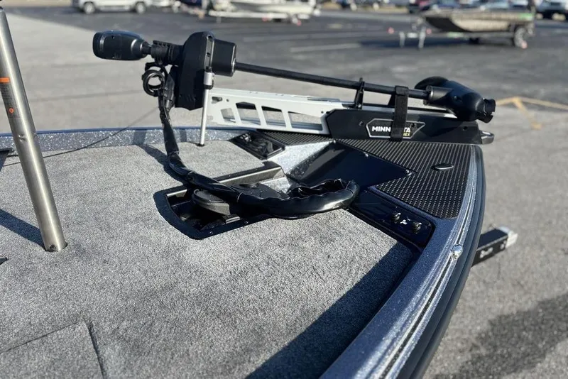Slide: The Image of 2026 Phoenix 721 ZXL boat deck with Minn Kota trolling motor in parking lot. - 14