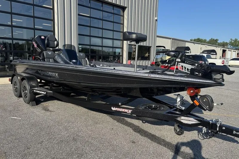 Slide: The Image of 2026 Phoenix 721 ZXL boat on trailer outside a showroom. - 5