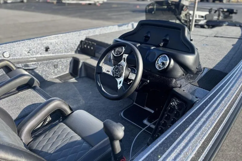 Slide: The Image of 2026 Phoenix 721 ZXL boat interior with steering wheel and dashboard controls. - 7