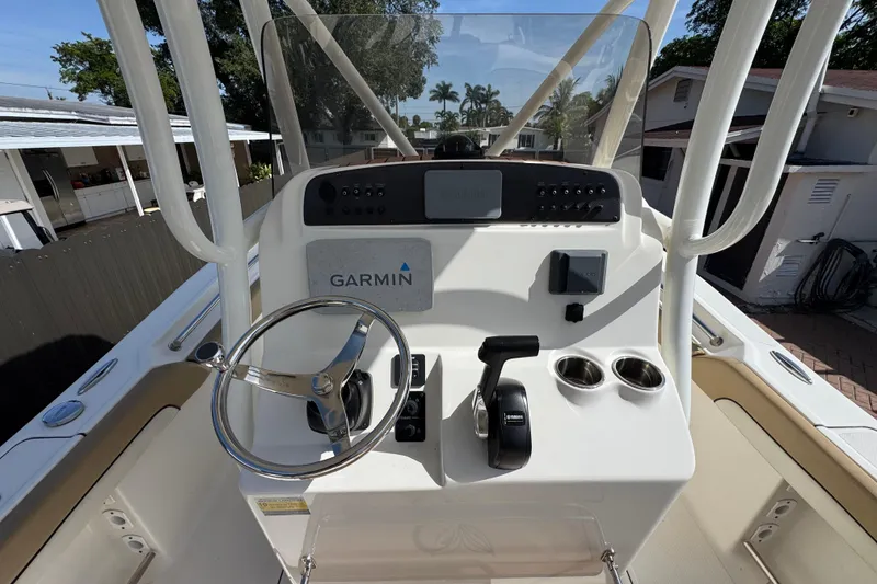Slide: The Image of 2020 Pioneer 222 Islander boat console with Garmin navigation and Yamaha controls. - 13