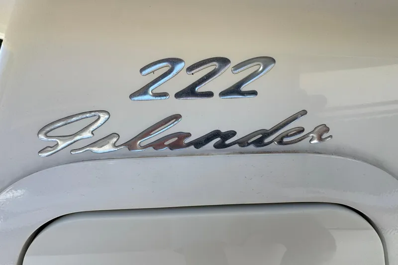 Slide: The Image of Close-up of 2020 Pioneer 222 Islander boat emblem in metallic finish. - 22
