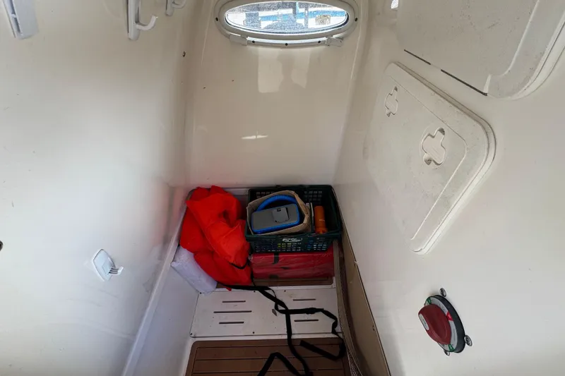 Slide: The Image of Interior cabin of 2020 Pioneer 222 Islander boat with storage and equipment. - 23