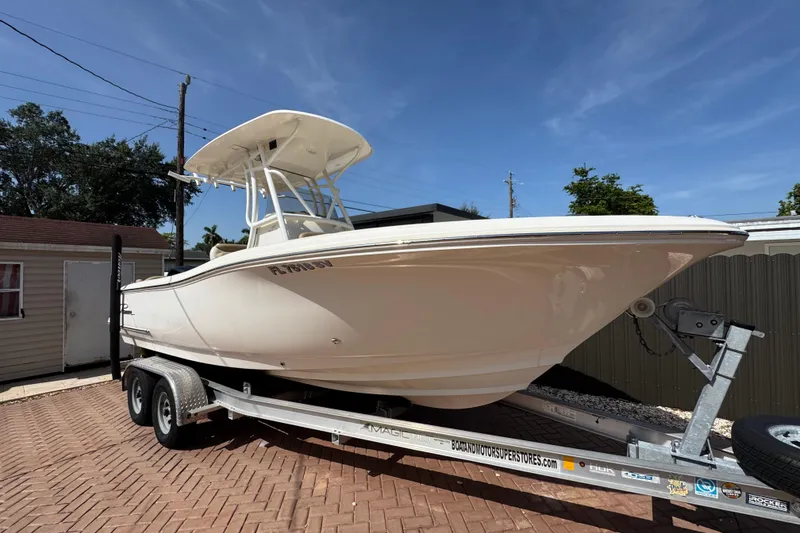 Slide: The Image of 2020 Pioneer 222 Islander boat on trailer under clear blue sky. - 5
