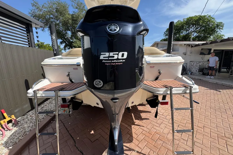 Slide: The Image of 2020 Pioneer 222 Islander boat with Yamaha 250 engine, parked in driveway. - 7