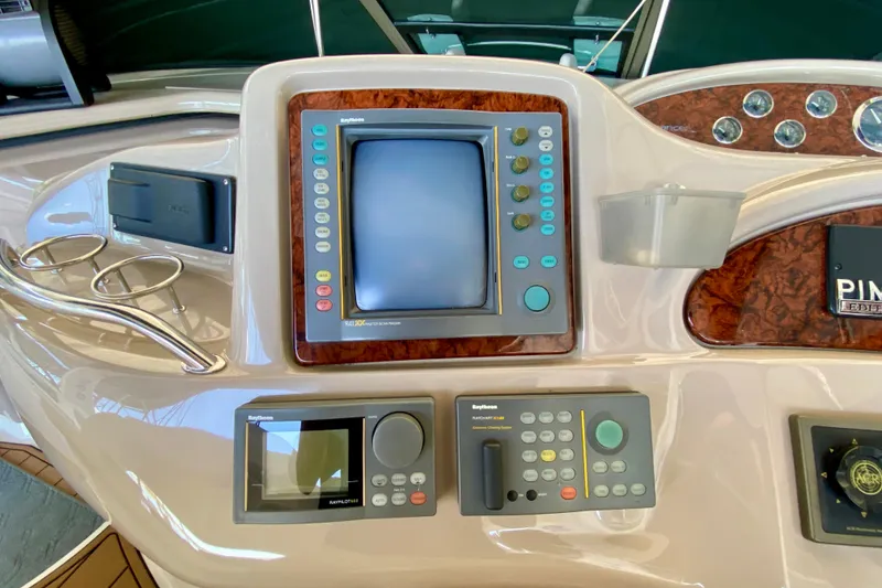 Slide: The Image of Control panel of a 1999 Sea Ray 460 Sundancer yacht with navigation equipment. - 20