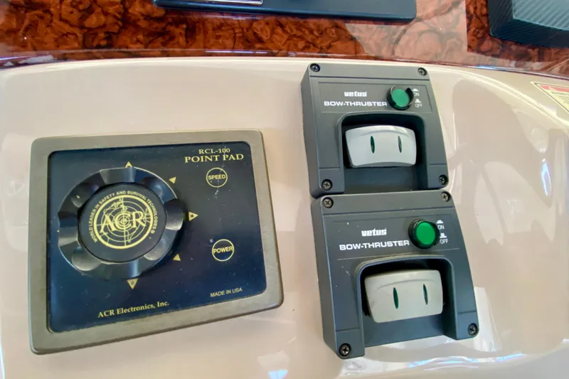 Slide: The Image of Control panel of a 1999 Sea Ray 460 Sundancer with bow thruster controls. - 22
