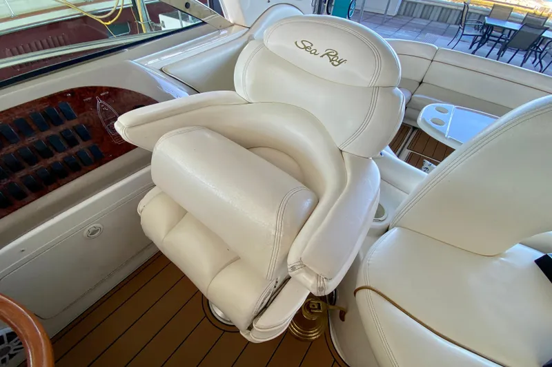 Slide: The Image of Luxurious white leather seating on 1999 Sea Ray 460 Sundancer yacht interior. - 24