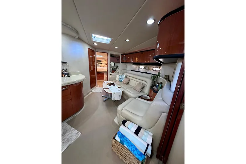 Slide: The Image of Luxurious interior of 1999 Sea Ray 460 Sundancer yacht with elegant seating and modern amenities. - 26