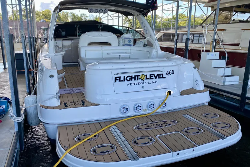 Slide: The Image of 1999 Sea Ray 460 Sundancer docked, featuring spacious deck and "Flight Level" branding. - 3