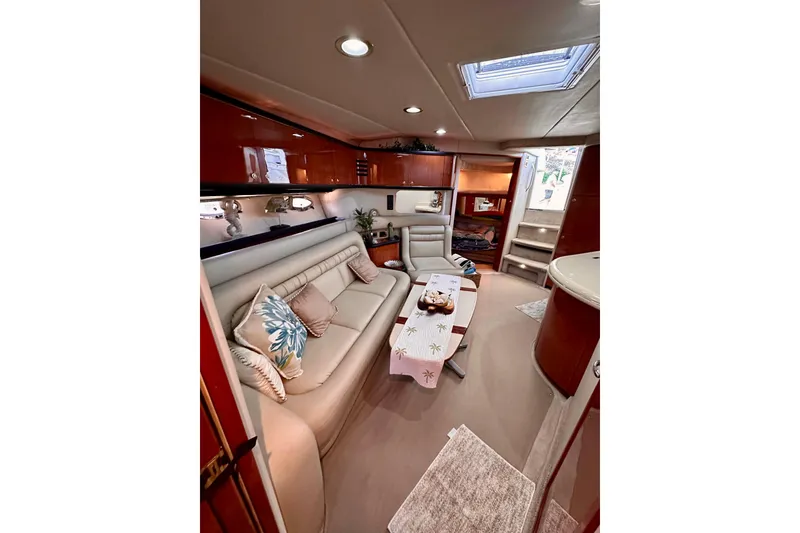Slide: The Image of Luxurious interior of 1999 Sea Ray 460 Sundancer yacht with elegant seating and decor. - 31