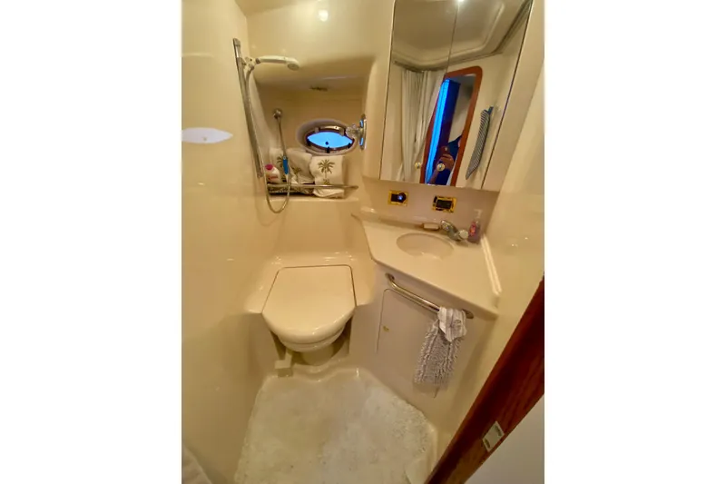 Slide: The Image of Bathroom interior of 1999 Sea Ray 460 Sundancer yacht, featuring compact design and amenities. - 35