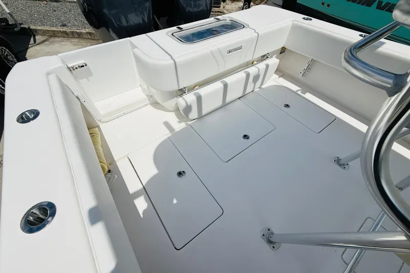 Slide: The Image of 2024 Contender 25 Open boat interior with storage compartments and seating. - 5