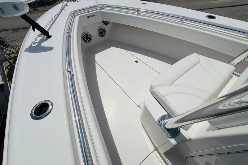 Slide: The Image of 2024 Contender 25 Open boat interior with white seating and stainless steel railings. - 7