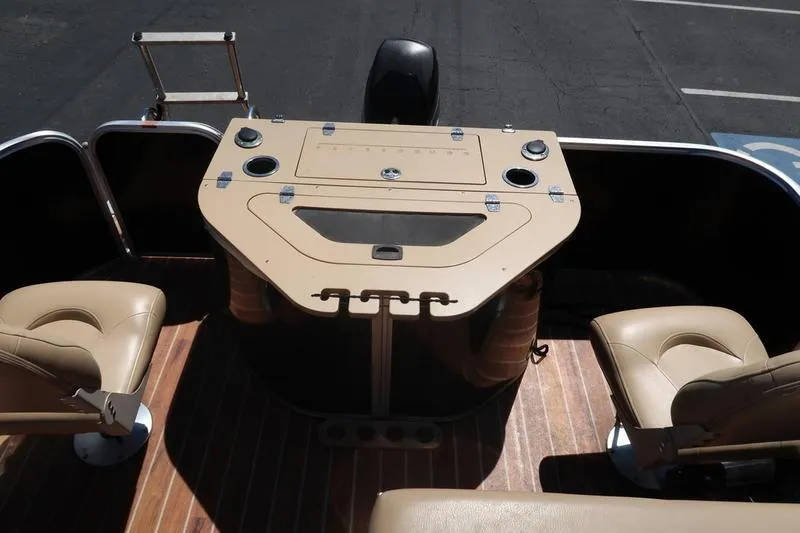 Slide: The Image of Interior of a 2013 Berkshire 231RFCSTS13 pontoon boat with seating and control panel. - 17