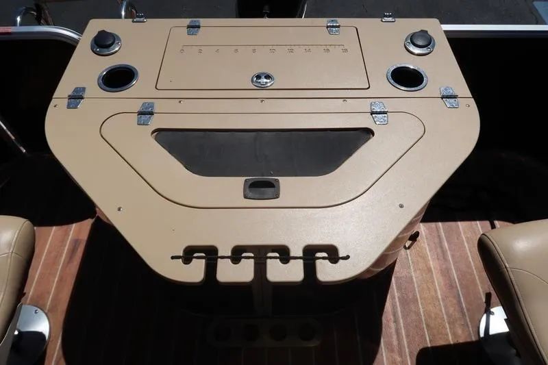 Slide: The Image of 2013 Berkshire 231RFCSTS13 boat console with beige finish and cup holders. - 23