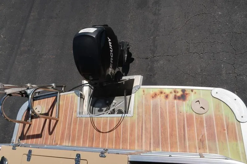 Slide: The Image of 2013 Berkshire 231RFCSTS13 boat with Mercury outboard motor on wooden deck. - 24