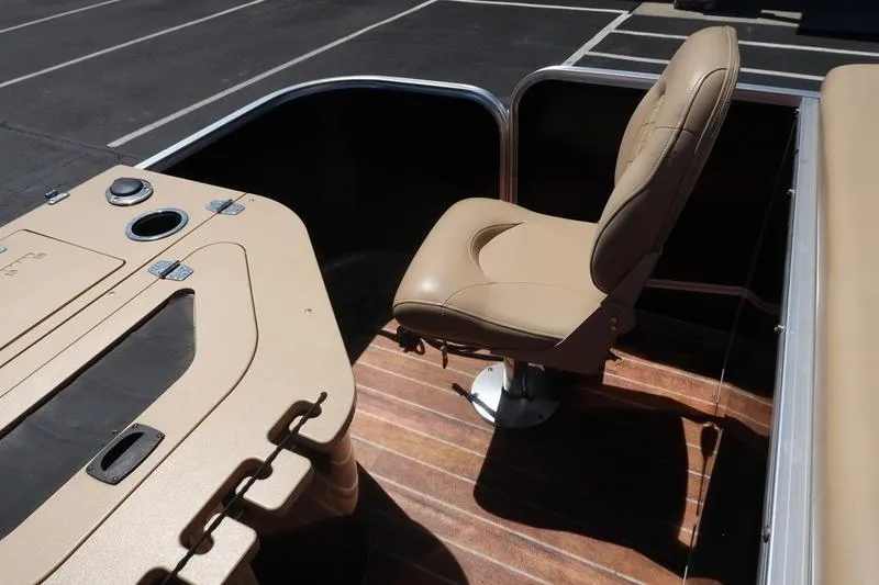 Slide: The Image of 2013 Berkshire 231RFCSTS13 boat interior with tan seating and wood flooring. - 26