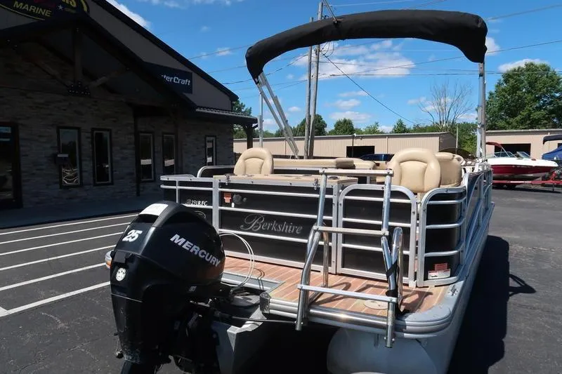 Slide: The Image of 2013 Berkshire 231RFCSTS13 pontoon boat with Mercury engine at a marina. - 5