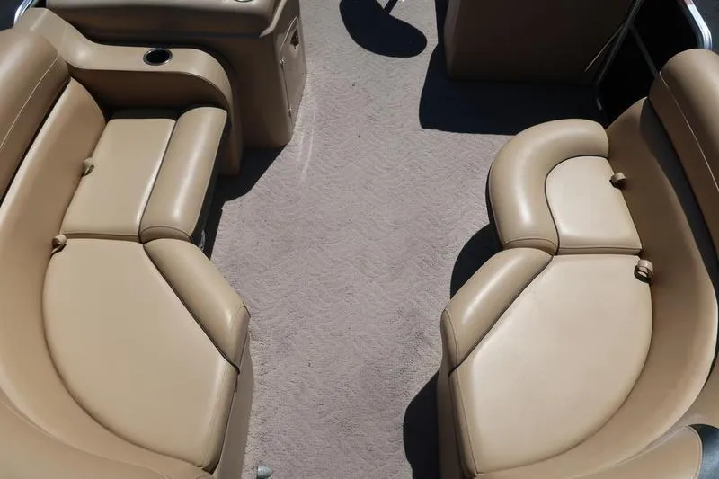 Slide: The Image of 2013 Berkshire 231RFCSTS13 boat interior with tan leather seating and carpeted floor. - 7