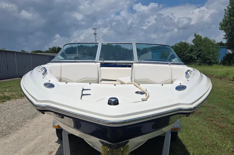 Slide: The Image of 2010 Chaparral 206 SSi boat on trailer, front view, under cloudy sky. - 6