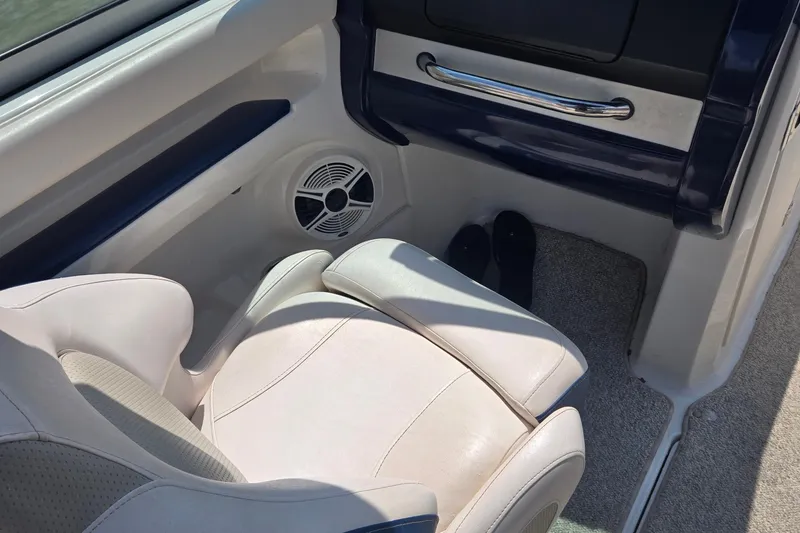 Slide: The Image of Interior of 2010 Chaparral 206 SSi boat with white seating and speaker. - 9