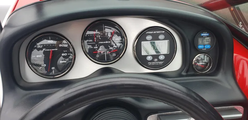 Slide: The Image of Dashboard of a 2004 MB B52-21 V/SK boat with speedometer and gauges. - 5